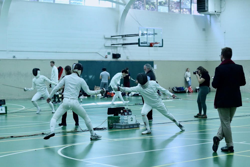 Two fencers face off at the Red Cedar Rumble fencing tournament in IM West on Oct. 8, 2023. 