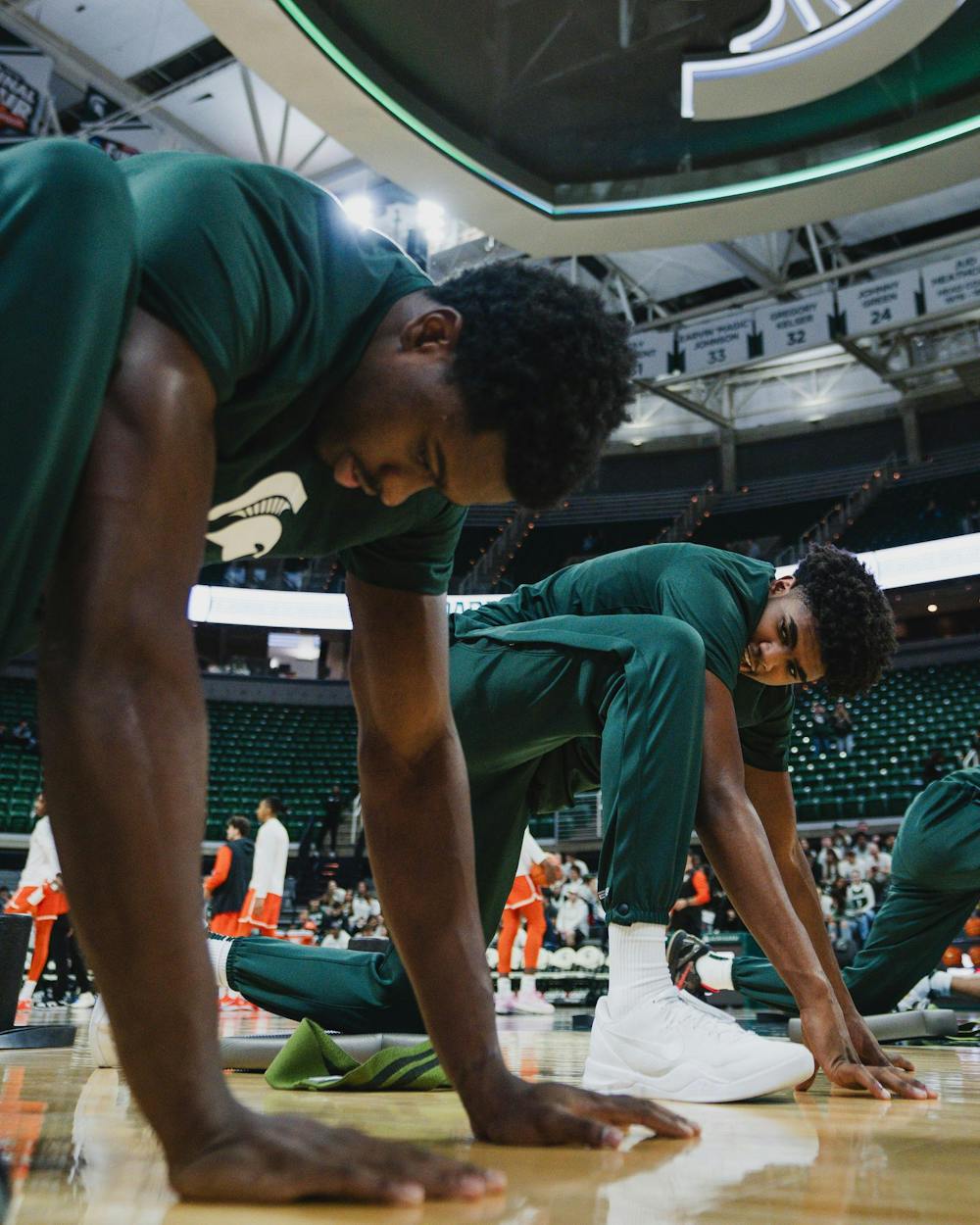 <p>MSU freshman guard Jase Richardson (11) looks at sophomore teammate Coen Carr (55) pregame, before MSU takes on Bowling Green at the Breslin center on Nov. 16, 2024</p>