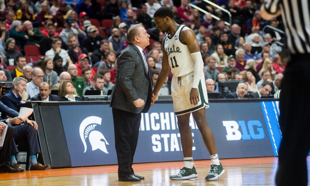 Head Coach Tom Izzo converses with freshman forward Aaron Henry (11) during the NCAA tournament game against Bradley at Wells Fargo Arena March 21, 2019. The Spartans defeated the Braves, 76-65.