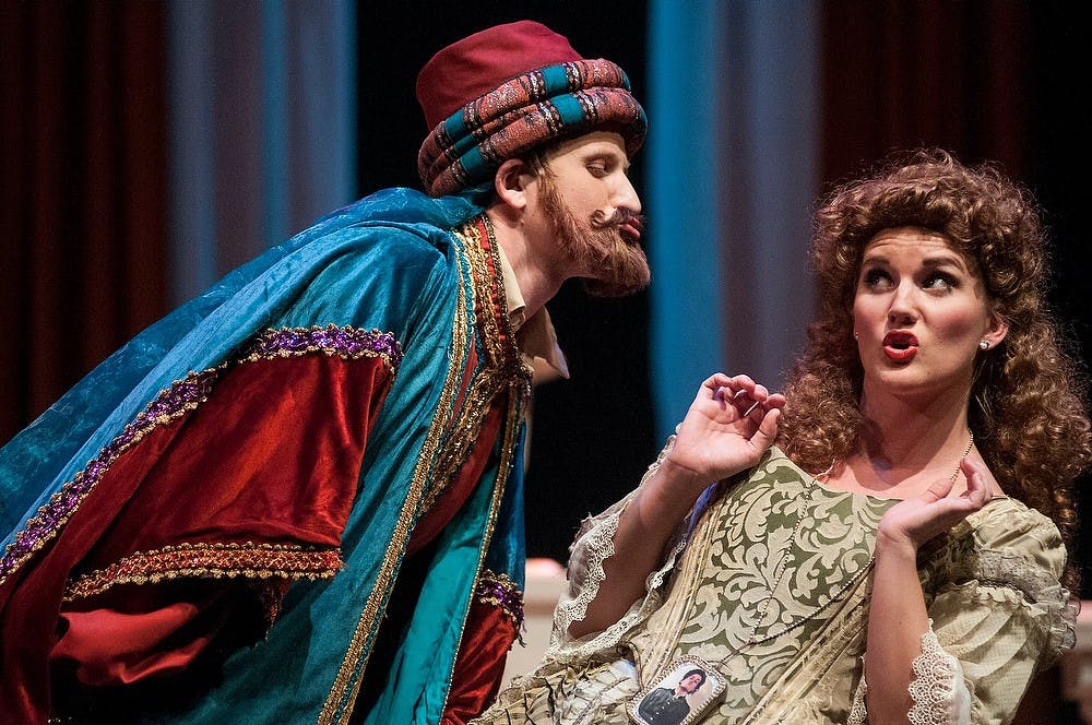 <p>Music performance senior Jon Oakley and music performance graduate Schyler Sheltrown rehearse for the production of Mozart's Cosi fan tutee on Nov. 17, 2014, at the MSU Auditorium. The show will run from Nov. 18 until Nov. 23. Aerika Williams/The State News </p>