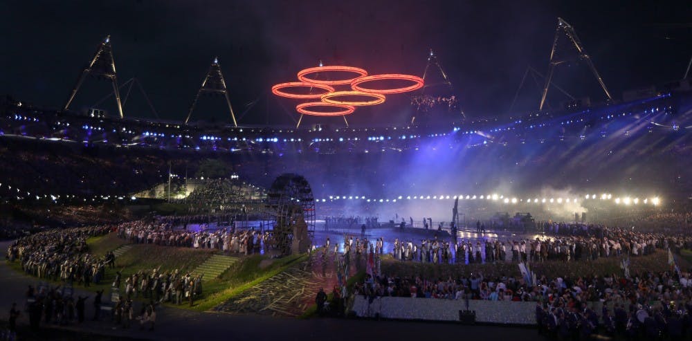 Olympic rings hover over the infield during the Opening Ceremonies of the 2012 Olympics at Olympic Stadium in London, England. The theme is "This is for everyone," and the volunteer cast is 7,500 strong. (Robert Gauthier/Los Angeles Times/MCT)