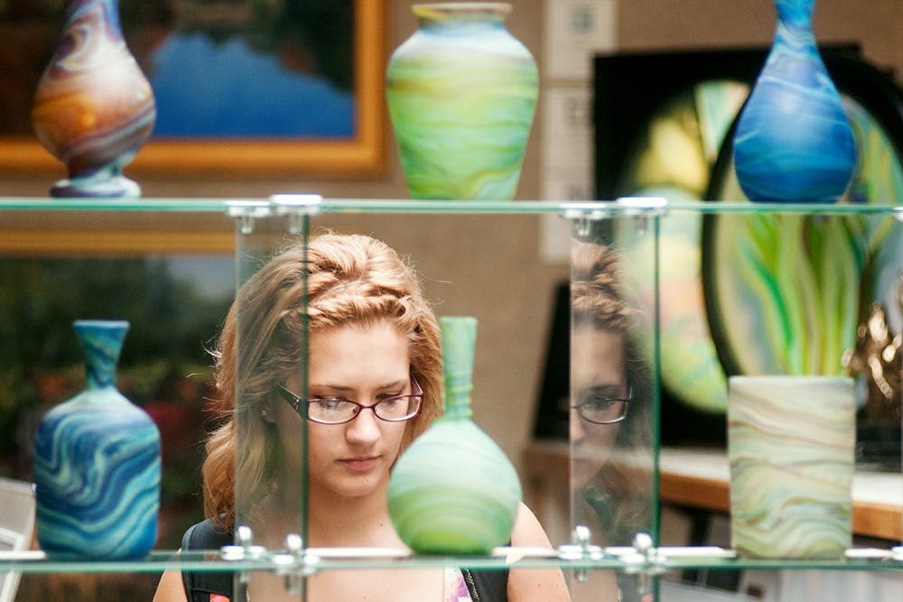 	<p>Elementary education Alyssa O&#8217;Connor looks at Hebron Glass Collection vases at Saper Galleries, 433 Albert Ave., on Thursday, Oct. 4, 2012. O&#8217;Connor was there with her poetry class. Julia Nagy/The State News</p>