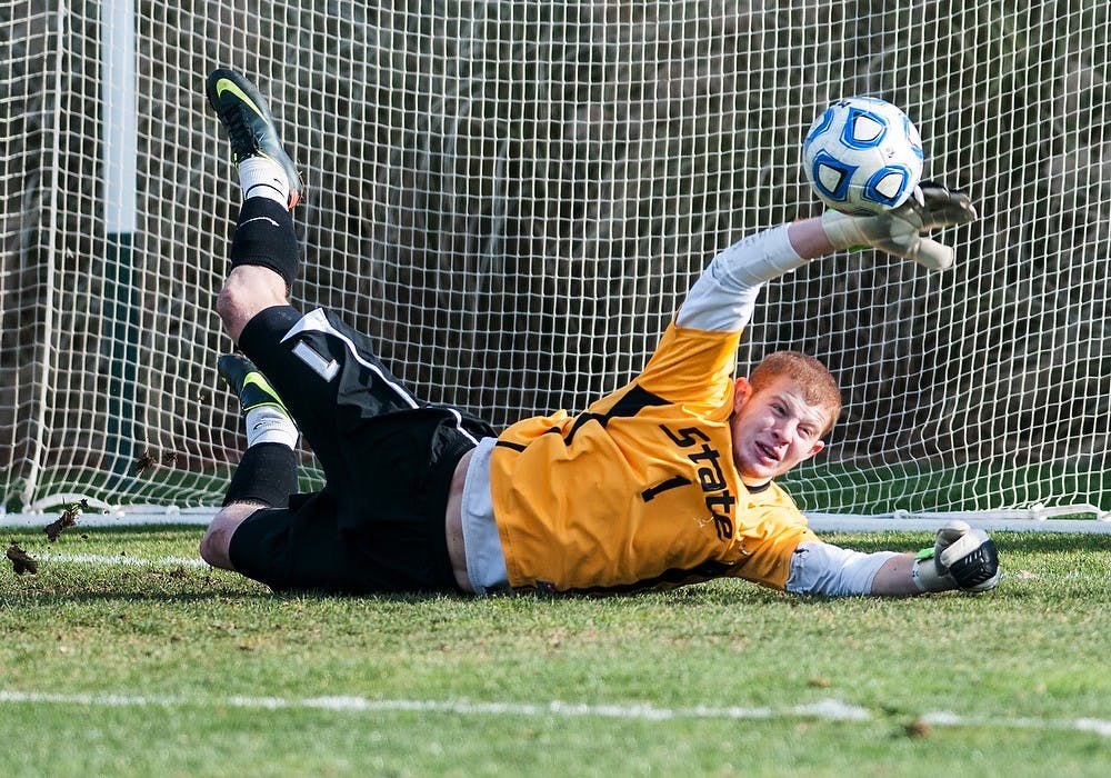	<p>Freshman goalkeeper Zach Bennett stops a Cleveland State penalty kick Thursday, Nov. 15, 2012, at DeMartin Stadium at Old College Field. The Spartans defeated Cleveland State, 2-1, in the first round of the <span class="caps">NCAA</span> Tournament, with the game-winning goal scored by senior midfielder Nick Wilson. Adam Toolin/The State News</p>