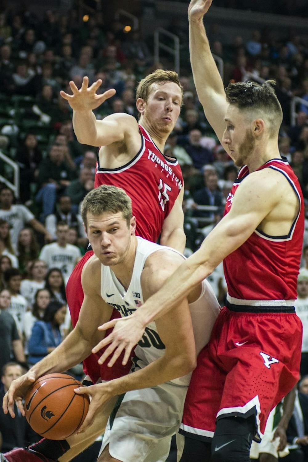 Senior forward Matt Van Dyk (30) brings the ball up the court during the second half of the men's basketball game against Youngstown State on Dec. 6, 2016 at Breslin Center. The Spartans defeated the Penguins, 77-57.