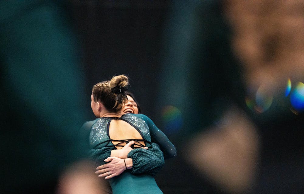 MSU gymnast celebrating after a successful event during the MSU v WMU v UMD at Jenison Field House in East Lansing, on Feb. 15th, 2026.