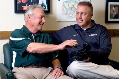 Many baseball teams must work together closely, but the Spartans are more of a family than most. Jake Boss Jr., right, is the head coach for the Spartans while his father, Jake Boss Sr., is a volunteer assistant coach.