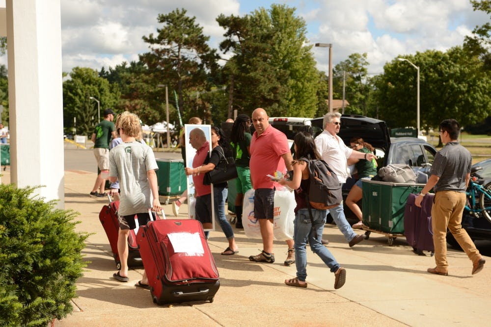 <p>Students and families move in to North Hubbard Hall during fall move-in day Aug. 25, 2019.</p>