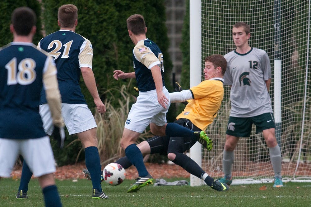 	<p>Sophomore goalkeeper Zach Bennett stops the ball Nov. 5, 2013, during the game against Notre Dame at DeMartin Stadium at Old College Field. The Spartans lost to the Fighting Irish, 2-0. Julia Nagy/The State News</p>