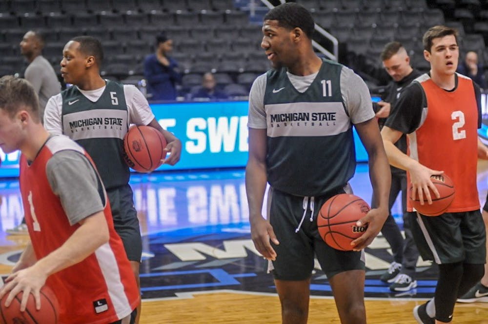 <p><br/><br/></p><p>Junior guard Cassius Winston (5), left, and freshman forward Aaron Henry (11), right, watch during the Spartan’s open practice at the Capital One Arena in Washington DC on March 28, 2019. Michigan State is scheduled to face Louisiana State University on March 29, 2019.</p>