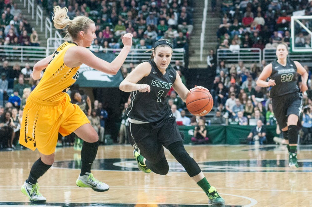 Junior guard Tori Jankoska fights past Iowa forward Kali Peschel during the first half of the game against Iowa on Jan. 16, 2016 at Breslin Center. The Spartans defeated the Hawkeyes, 80-73. 