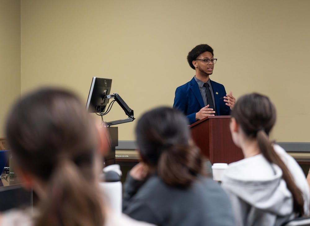 The public listens intently to current ASMSU Vice President for Governmental Affairs, Deonte Sparks, to hear his answers to questions during his race for ASMSU President in the Student Affairs & Services building in East Lansing, MI on April 14, 2026.