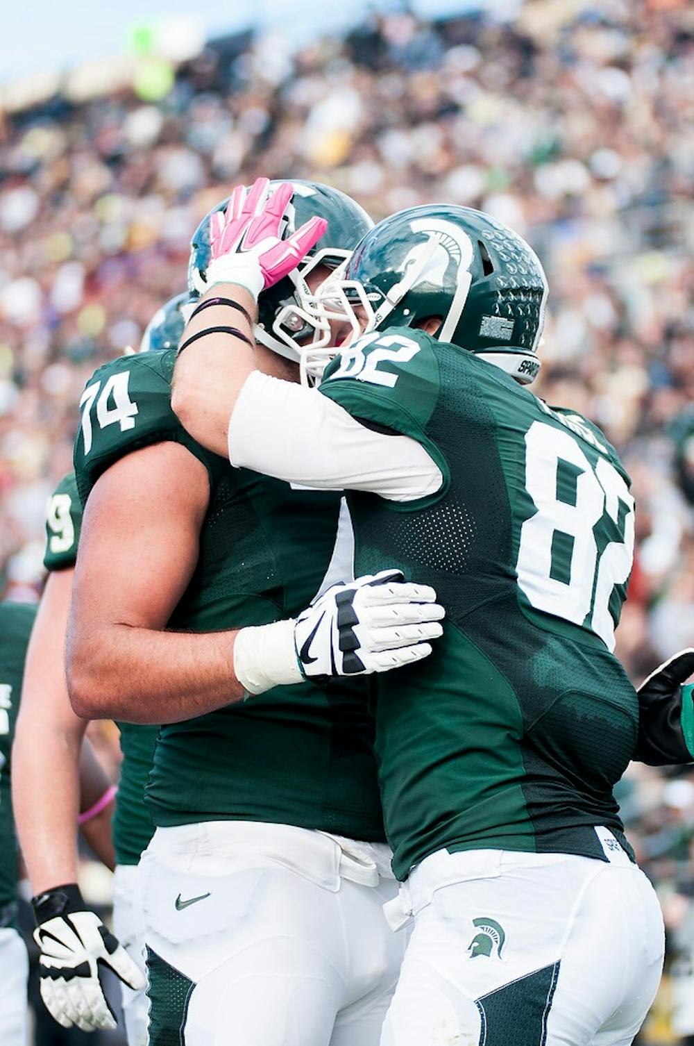 <p>Sophomore tight end Josiah Price celebrates with sophomore offensive tackle Jack Conklin Saturday during a game against Purdue at Ross-Ade Stadium. The Spartans defeated the Boilermakers,  45-31. Photo courtesy of Purdue Exponent/Mujtabaa Hasan</p>
