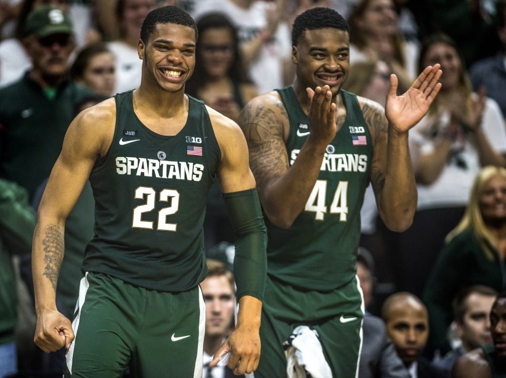 Sophomore forward and guard Miles Bridges (22), left, and Sophomore forward Nick Ward (44) react to a play during the game against Hillsdale on Nov. 3, 2017 at the Breslin Center.The Spartans defeated the Chargers, 75-44.