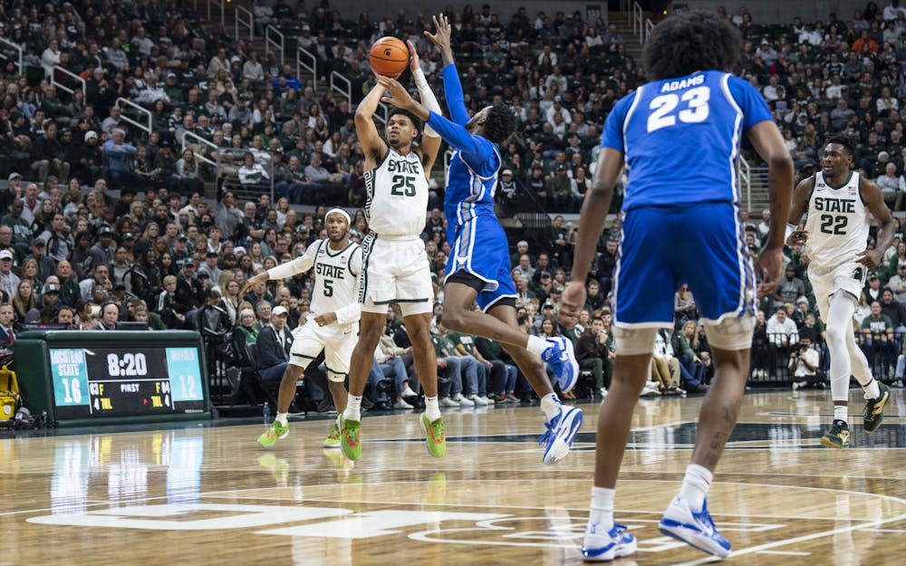 Senior forward Malik Hall, 25, shoots a three-pointer during Michigan State’s game against Buffalo on Friday, Dec. 30, 2022 at the Breslin. The Spartans ultimately beat the Bulls, 89-68.