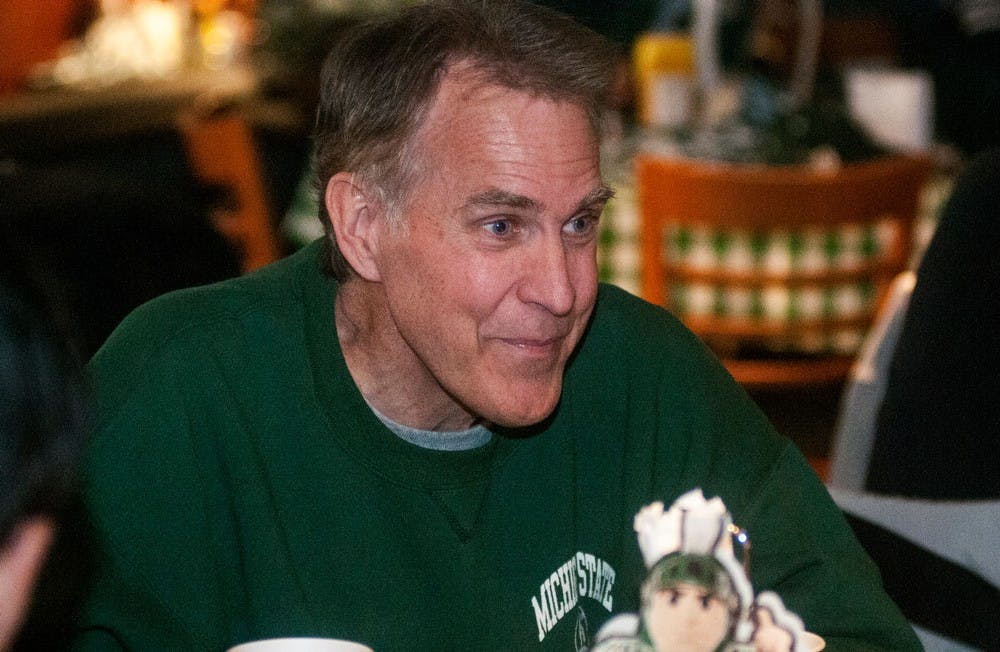 	<p>Dave Bergman, former Detroit Tiger and member of the 1984 World Series team talks with his family while waiting for the rain delay Wednesday, April 17, 2013, at Comerica Park in Detroit.</p>