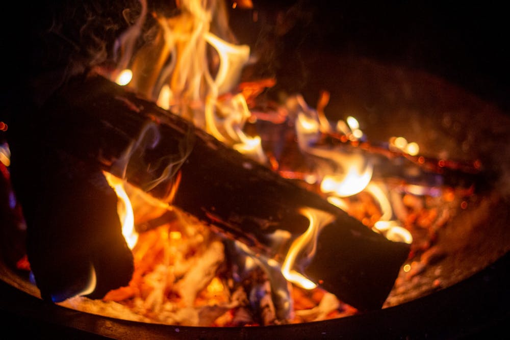 A bonfire burns in my backyard.
