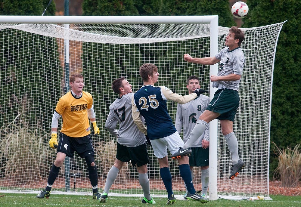 	<p>Senior defender Kevin Cope goes up to head the ball away from the goal Nov. 5, 2013, during the game against Notre Dame at DeMartin Stadium at Old College Field. The Spartans lost to the Fighting Irish, 2-0. Julia Nagy/The State News</p>