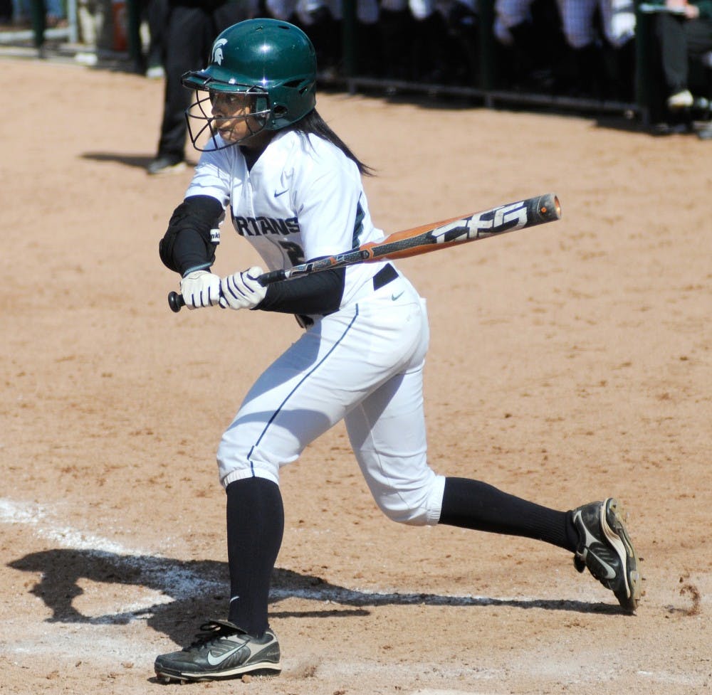 Senior outfielder Lori Padilla hts a ball on Saturday afternoon at Secchia Stadium at Old College Field during the game against Iowa, which the team lost by 7-. Justin Wan/The State News