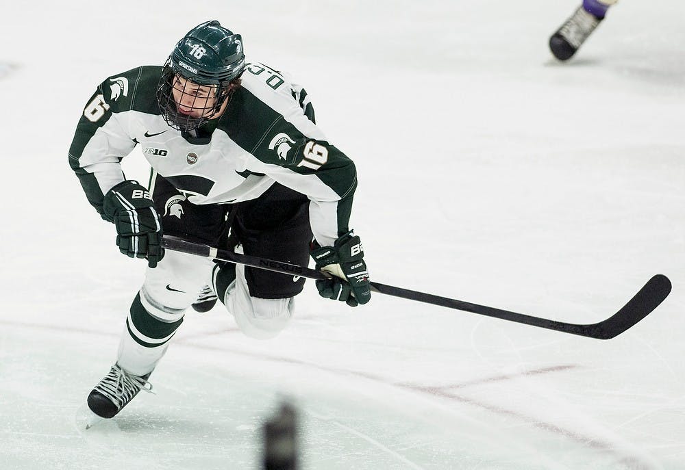 	<p>Senior forward Dean Chelios skates after the puck during the game against Western Ontario on Oct. 9, 2013, at Munn Ice Arena. The Spartans defeated the Mustangs, 4-1, in the first exhibition game of the season. Danyelle Morrow/The State News</p>