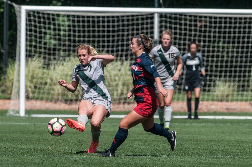 Junior midfielder Madison Duncan (7) passes the ball forward during a game against the University of Detroit on Sept. 11, 2016 at DeMartin Stadium at Old College Field. The Spartans defeated the Titans, 2-0. 