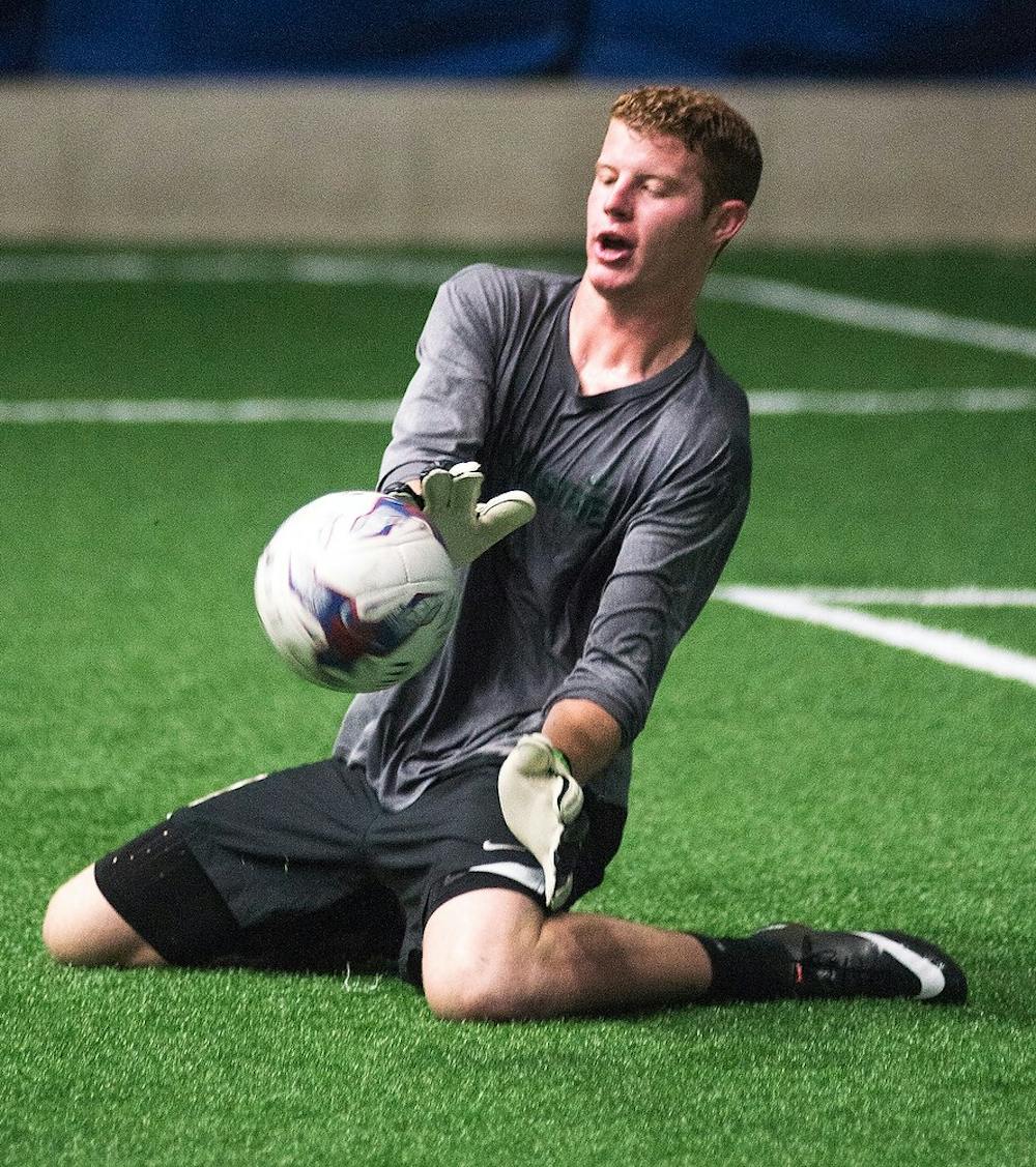 <p>Lansing United goalkeeper Zach Bennett practices with the team July 8, 2014, at Lansing Indoor Sports Arena, 5849 Enterprise Drive, in Lansing. Bennett is also one of the current starting goalkeepers for Michigan State Soccer. Danyelle Morrow/The State News</p>