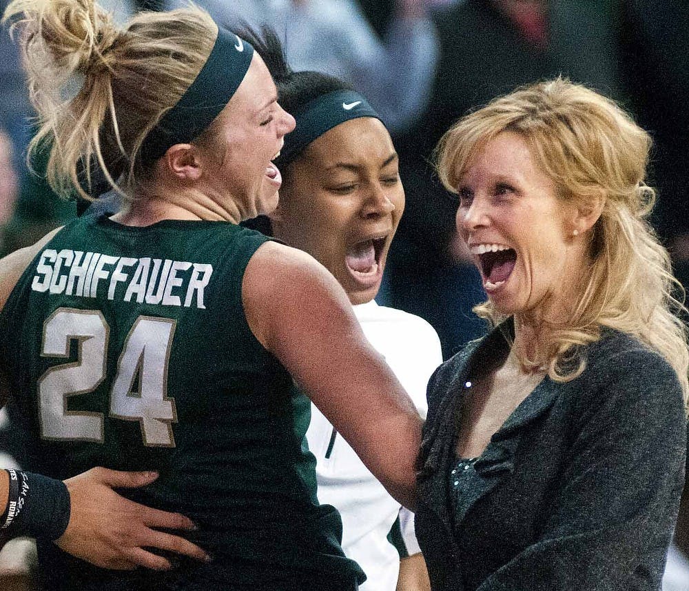 The Spartans celebrate their 54-46 win against Penn State on March, 9, 2013, at Sears Centre in Hoffman Estates, Ill. during the Big Ten Tournament.  The Spartans will play Purdue for the Big Ten Tournament trophy March 10, 2013. Julia Nagy/The State News 