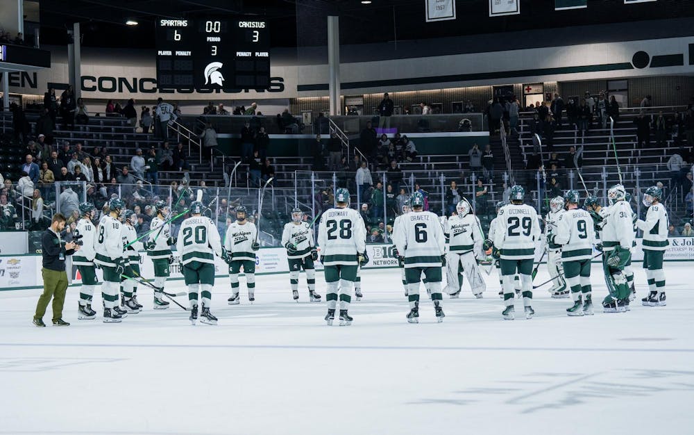 <p>The MSU hockey team circle up after winning the game against Canisius at Munn Ice Arena on Oct. 19, 2023. The Spartans beat the Griffins 6-3 in one of a two-game series.</p>