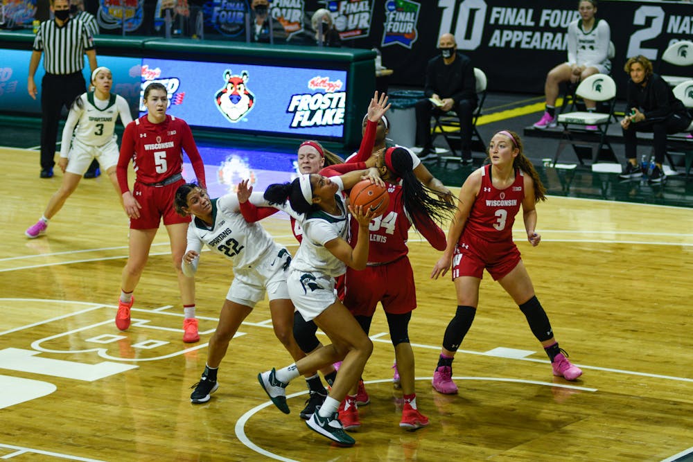 <p>Michigan State&#x27;s Alisia Smith (4) up against Wisconsin&#x27;s defense on the game in East Lansing on Saturday, Mar. 6 2021.</p>