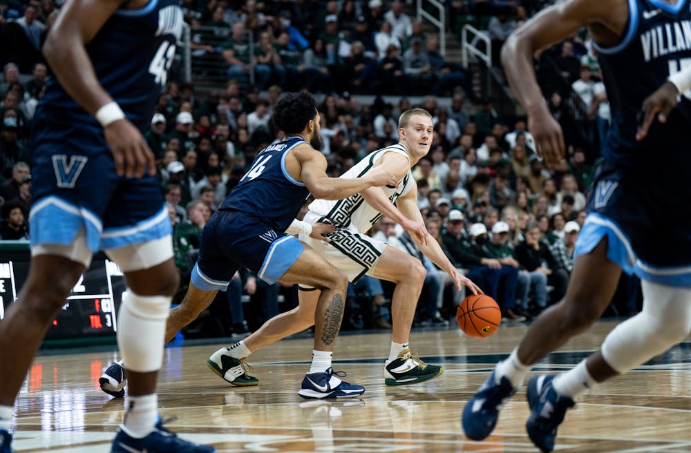Graduate student forward Joey Hauser (10) dribbles the ball during a game against Villanova at the Breslin Center on Nov. 18, 2022. The Spartans defeated the Wildcats 73-71. 