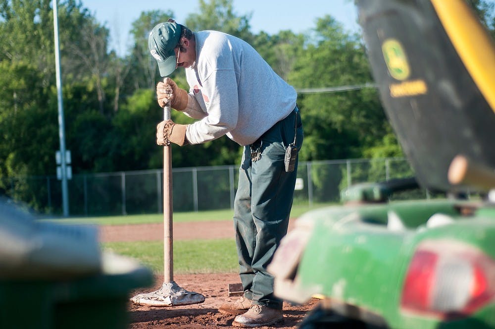 	<p>Dan Perry, a maintenance man for the city of Lansing,  stamps down clay on the pitcher&#8217;s mound of Kircher-Municipal Ball Park, 203 S. Clippert in Lansing, June 20, 2013. Perry has been maintaining baseball fields since 1996. Danyelle Morrow/The State News</p>