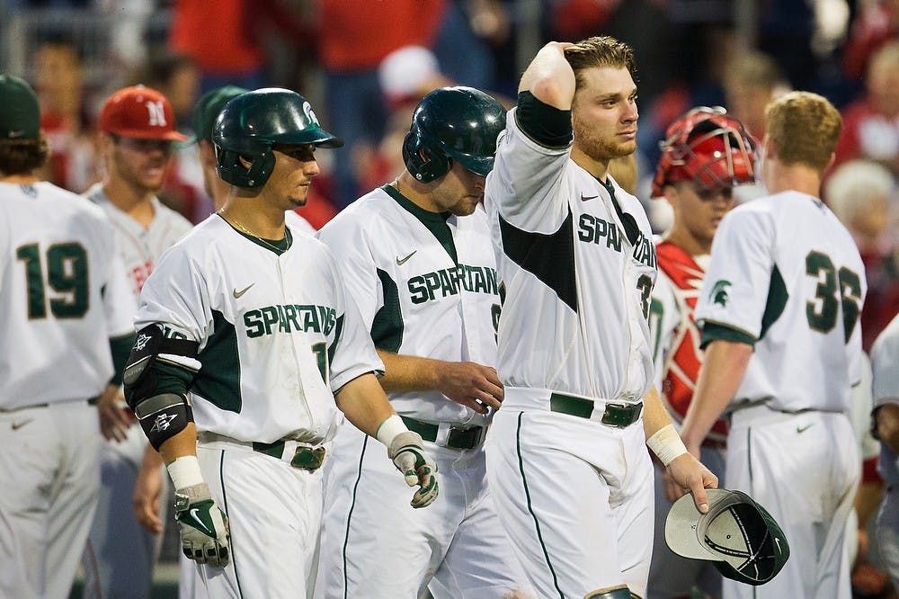 <p>Senior catcher Joel Fisher walks off the field May 22, 2014, during the Big Ten Baseball Tournament at TD Ameritrade Park in Omaha, Nebraska. The Cornhuskers defeated the Spartans, 3-2.</p><p>Photo courtesy of Julia Nagy/The Omaha World-Herald</p>