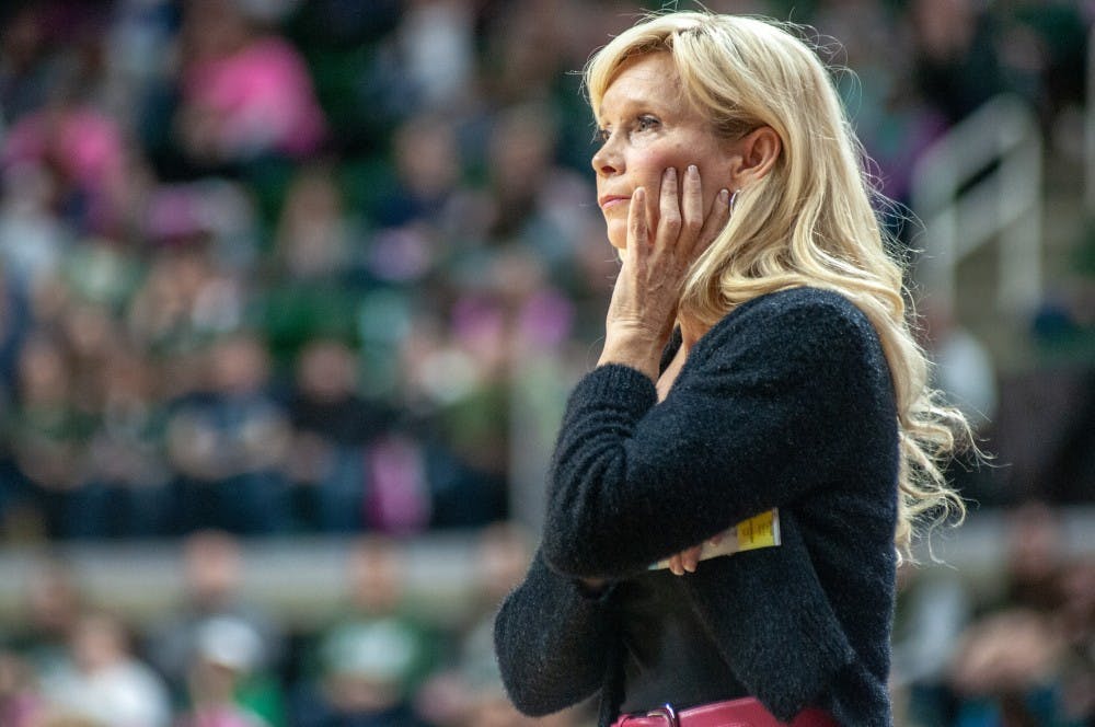 <p>Head women's basketball coach Suzy Merchant watches during the women’s basketball game against Purdue on Feb. 3, 2019, at Breslin Center. The Spartans defeated the Boilermakers, 74-66.</p>