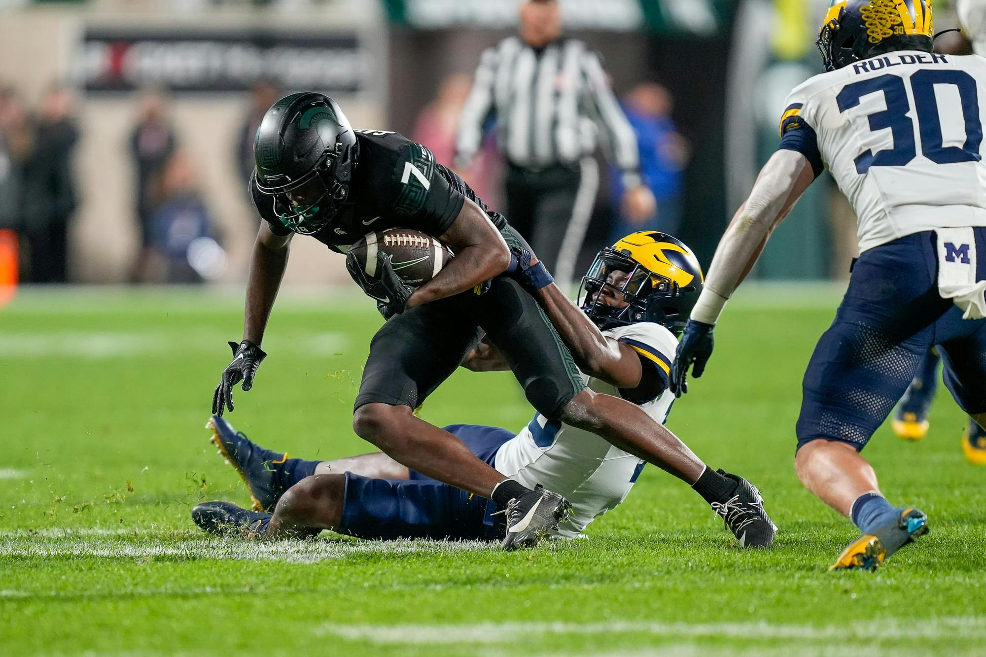 <p>Redshirt freshman wide receiver Antonio Gates Jr. (7) being tackled during a game against University of Michigan at Spartan Stadium on Oct. 21, 2023. The Spartans would end the game with only 133 total receiving yards.</p>