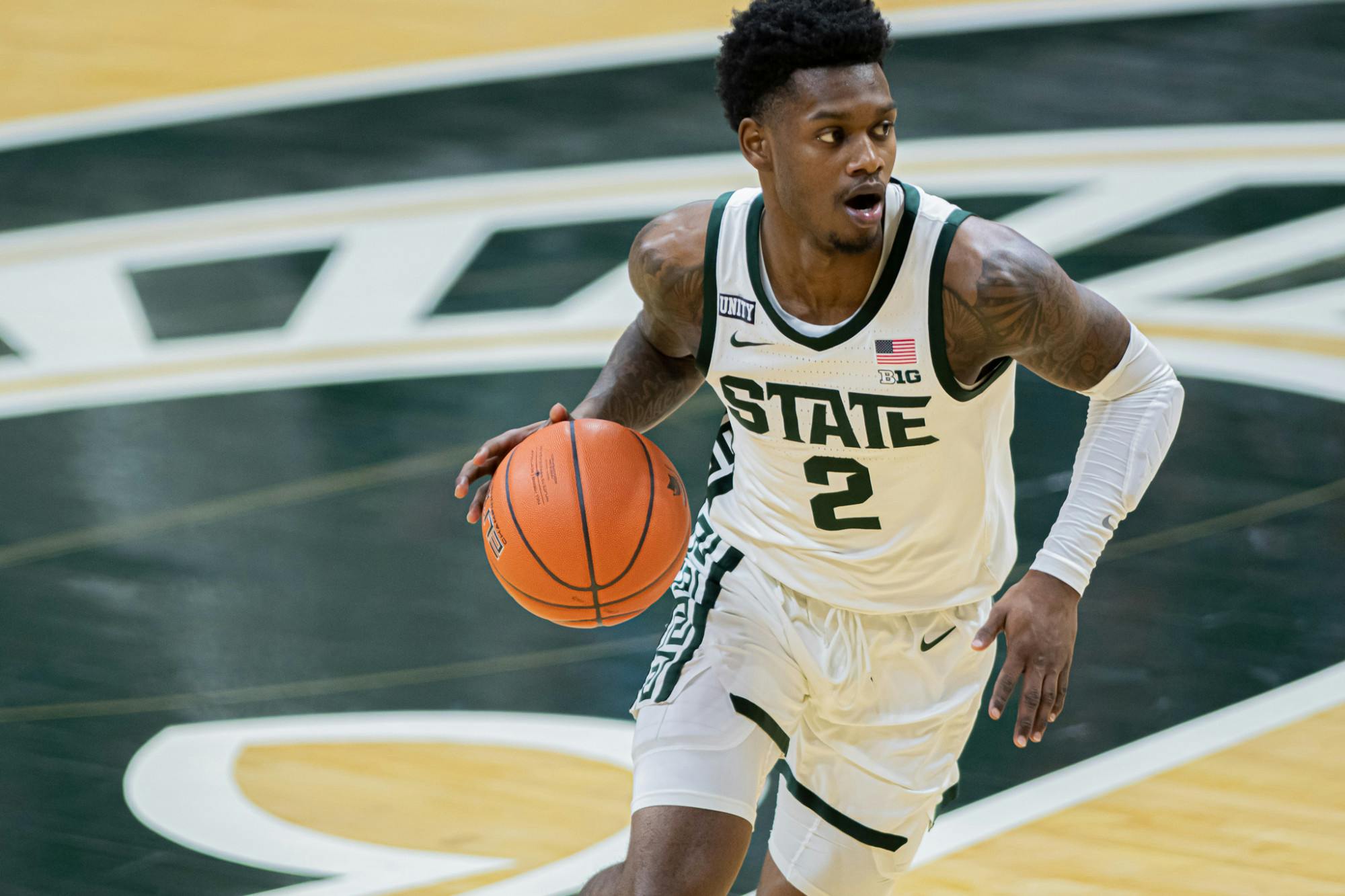 <p>Then-sophomore guard Rocket Watts pushes the ball up court during the Spartans&#x27; 70-64 upset against the No. 2 Wolverines on Mar. 6, 2021.</p>