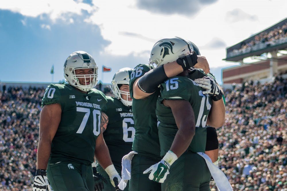 The Spartans celebrate after a touchdown during the game against Central Michigan at Spartan Stadium on Sept. 29, 2018. The Spartans defeated the Chippewas 31-20.