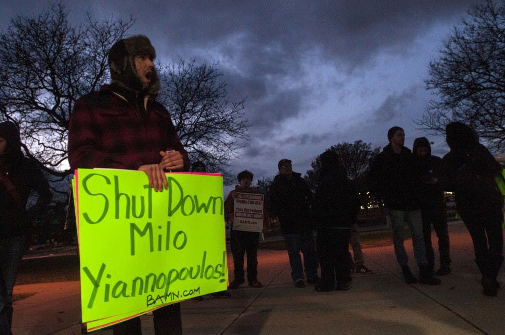 People gather to protest the visit of speaker Milo Yiannopoulos on Dec. 7, 2016 outside Conrad Hall. Yiannopoulos' ?Dangerous Faggot Tour? has incited a rash of hate crimes and physical confrontations at numerous universities.