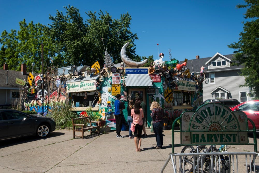 Customers wait in line to be admitted inside on June 8, 2016 at Golden Harvest at 1625 Turner St. in Lansing, Mich.