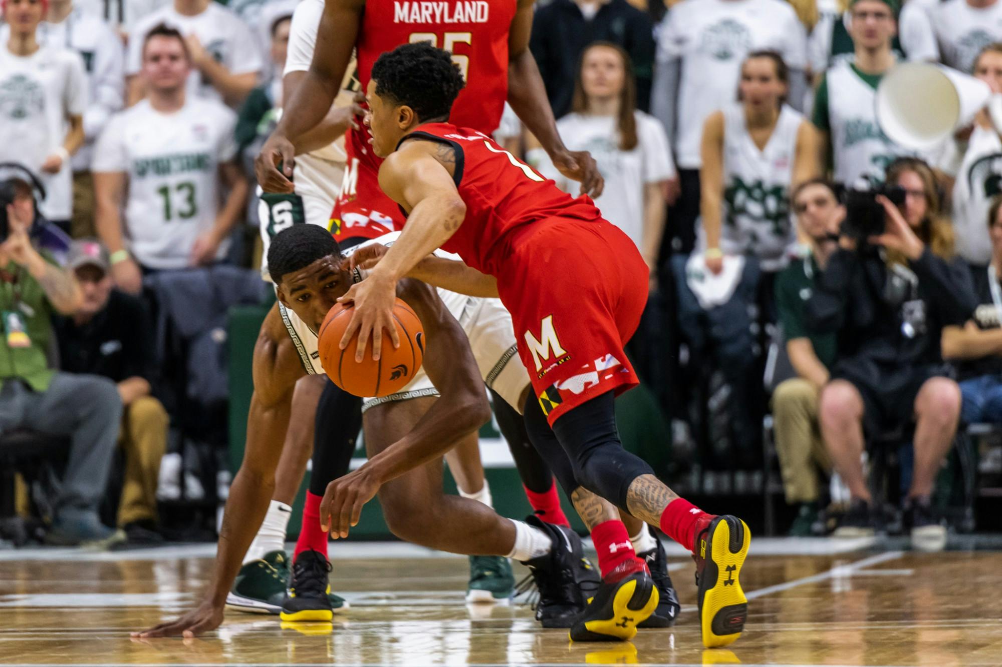 <p>Sophomore guard Aaron Henry (left) defends Maryland’s Anthony Cowan Jr (right).</p>