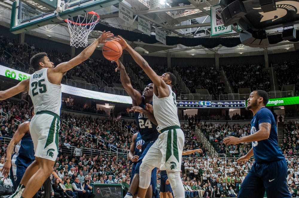 
 Spartans fight for the ball during the game against Penn State on Jan. 31, 2018 at Breslin Center. 

