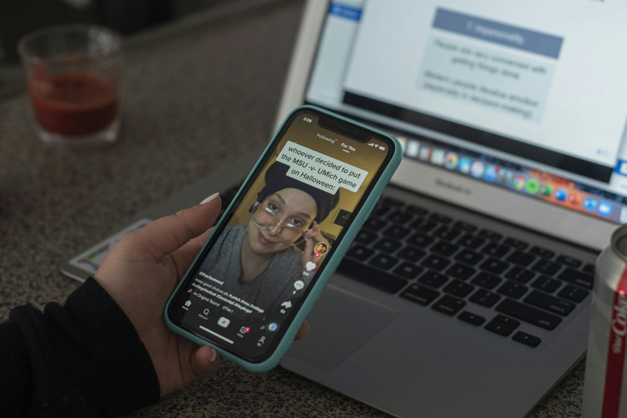 <p>A student watches TikTok, a popular app for making videos, during a lecture on Zoom. Shot on Sept. 21, 2020.</p>