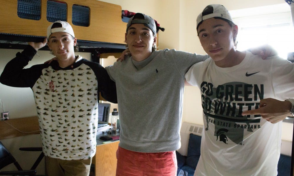 <p>From left to right, freshmen, brothers and triplets Jason, Michael and Patrick Gantos pose in their dorm on Sep. 12, 2017 in Hubbard Hall. Jason is a computer science major while Michael and Patrick are both pre-med. The brothers are from Grand Rapids.</p>