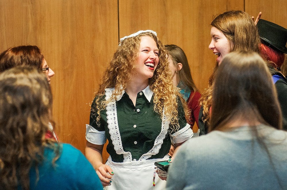Animal science junior Heather Stark laughs with friends Friday at the International Center. Stark was dressed up for a showing of the "Rocky Horror Picture Show" put on by the UAB and the Wharton Center Student Marketing Organization. James Ristau/The State News