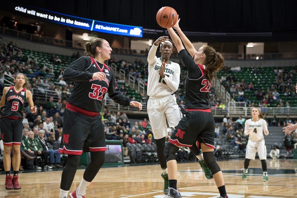 Red shirt freshman Victoria Gaines passes the ball to a teammate as she is defended by Nebraska center Allie Havers during the game against Nebraska on Jan. 7, 2017 at the Breslin Center. The Spartans defeated the Cornhuskers, 93-73.