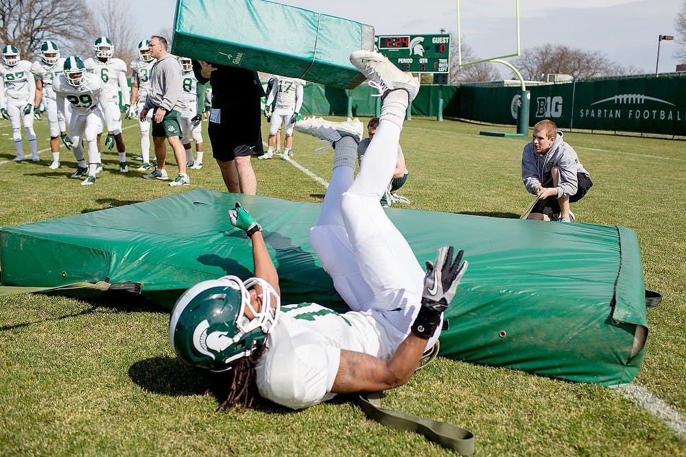 	<p>Sophomore cornerback Trae Waynes participates in a drill during football practice Tuesday at the practice field outside Duffy Daugherty Football Building. Waynes has taken command of the starting spot at the position. Natalie Kolb/The State News</p>
