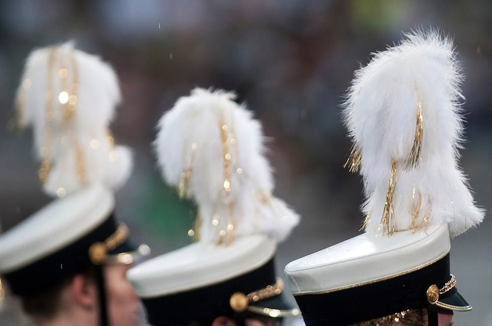 	<p>Members of the Western Michigan University Marching Band line up along the sidelines of the field on Aug. 30, 2013, at Spartan Stadium. The Spartans defeated the Broncos, 26-13. Katie Stiefel/The State News</p>