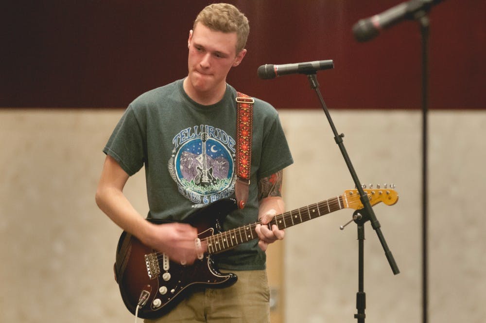 Advertising junior Colin Tracey plays a guitar on Dec. 9, 2016 in the Union. Tracey played original songs and covers at the MSU Finals Relaxer hosted by UAB, RHA, and ASMSU.