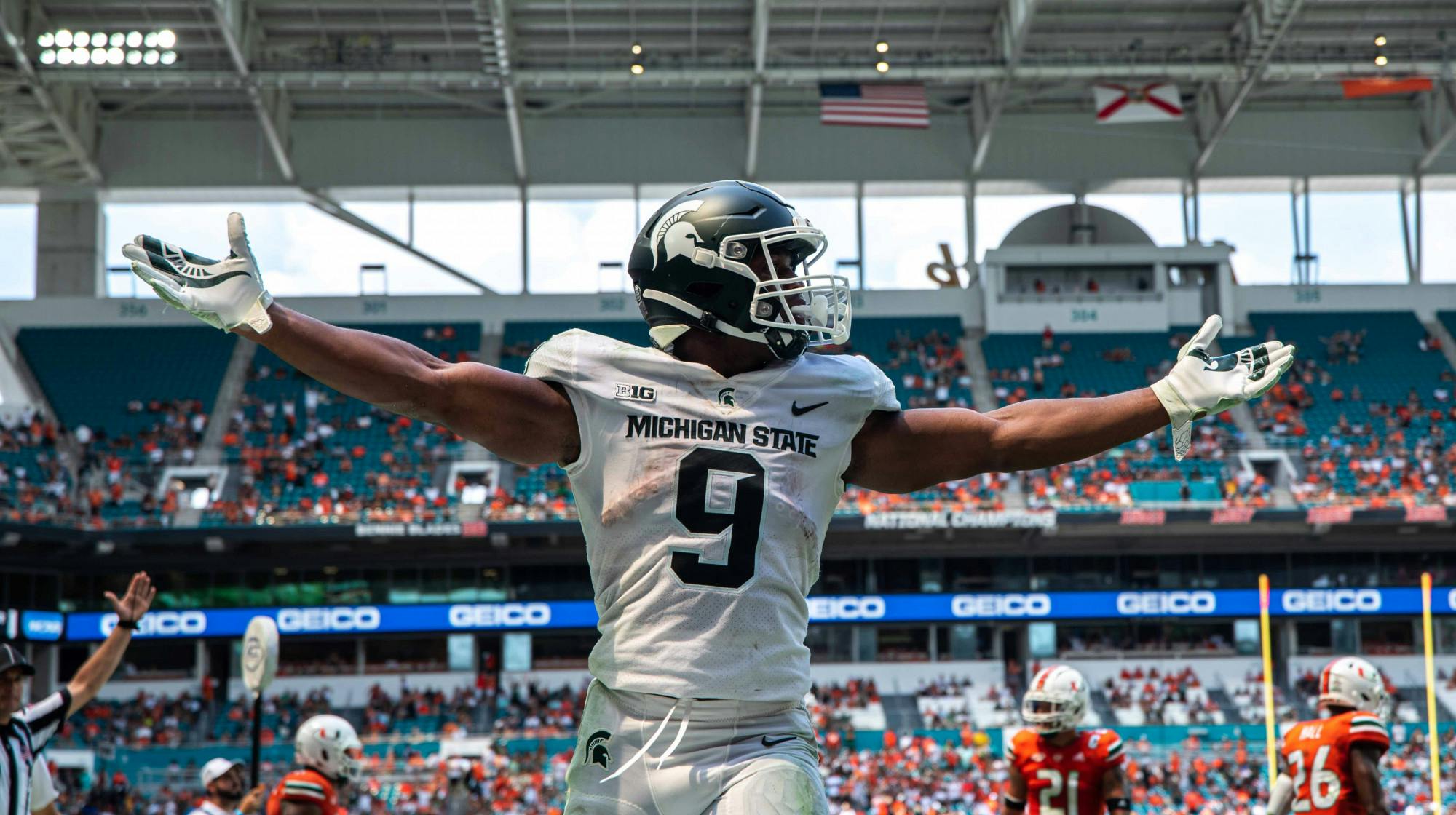 <p>Junior running back Kenneth Walker III (9) celebrates after scoring a touchdown in the second quarter of the game against Miami on Sept. 18, 2021. </p>