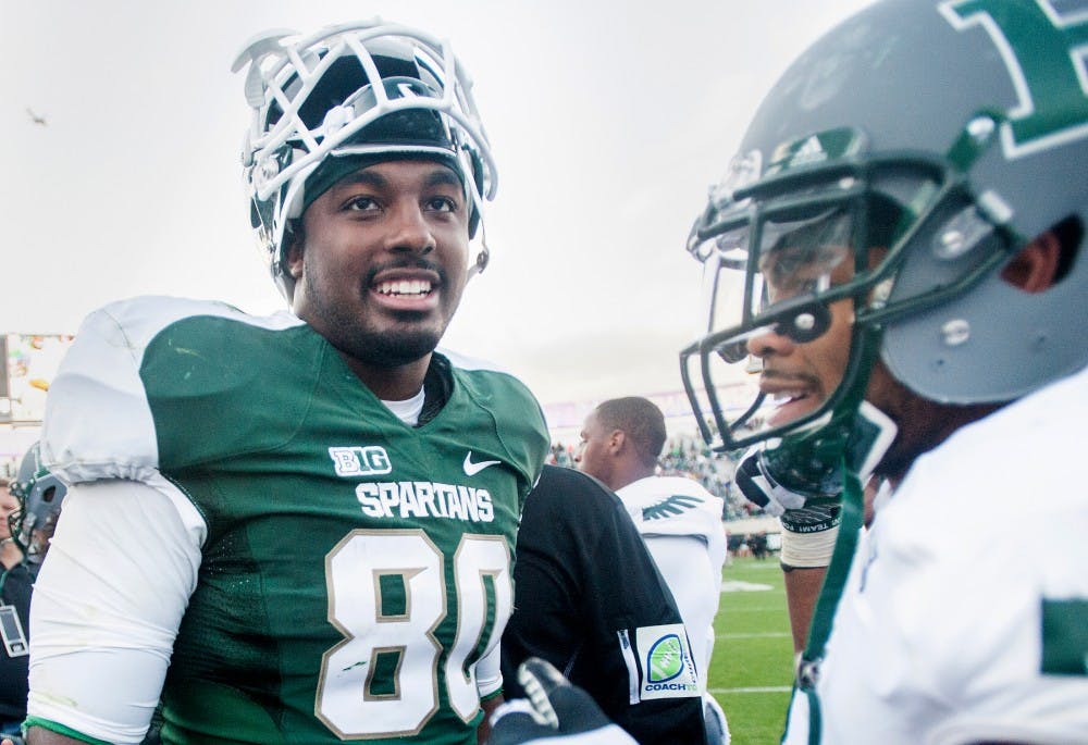 Junior tight end Dion Sims smiles after defeating Eastern Michigan, 23-7, on Saturday, Sept. 22, 2012, at Spartan Stadium. Sims had one touchdown during the game. Justin Wan/The State News