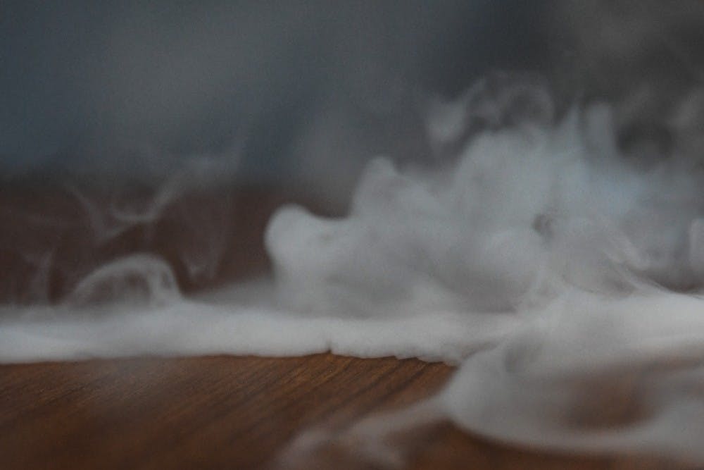 <p>Vape smoke rises from a table on Sept. 3 2019.</p>