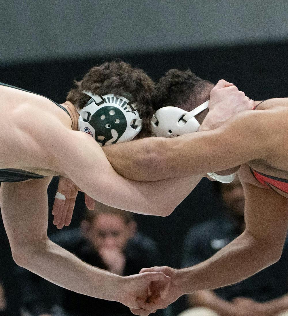 Rising senior Andy Hampton battles a Rutgers opponent during the dual match at Jenison Field house on Feb. 13, 2026.